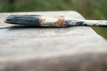 Paintbrush covered in paint and used