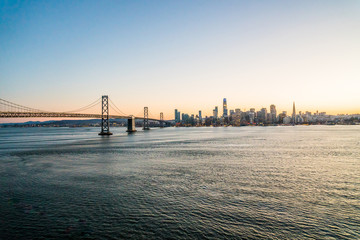 Panoramic beautiful scenic view of the Oakland Bay Bridge and the SF city at dusk, San Francisco,...