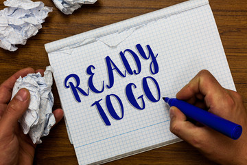 Conceptual hand writing showing Ready To Go. Business photo showcasing asking someone if he is prepared or packed his things Man holding marker notebook crumpled papers ripped pages