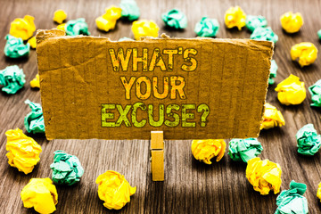 Text sign showing What s is Your Excuse question. Conceptual photo Explanations for not doing something Inquiry Paperclip grip cardboard with texts many colorful lobs scattered on wooden desk