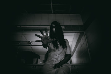 Portrait of asian woman make up ghost face with blood,Horror scene,Scary background,Halloween...
