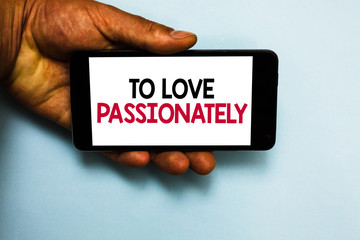 Handwriting text To Love Passionately. Concept meaning Strong feeling for someone or something else Affection Human hand hold mobile phone with some black and red color letters
