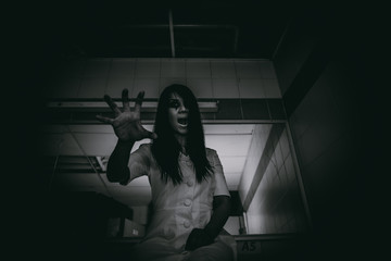 Portrait of asian woman make up ghost face with blood,Horror scene,Scary background,Halloween...