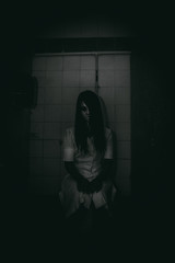 Portrait of asian woman make up ghost face with blood,Horror scene,Scary background,Halloween...