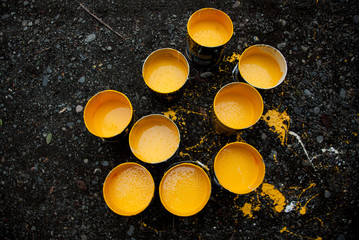 Paint Pot with yellow colors for marking the central reserve on Street