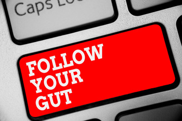Word writing text Follow Your Gut. Business concept for Listen to intuition feelings emotions conscious perception Keyboard red key Intention create computer computing reflection document