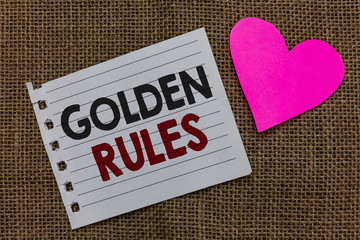 Conceptual hand writing showing Golden Rules. Business photo text Basic principle that should be followed Important Principle Piece paper Romantic ideas Communicate feelings Jute background