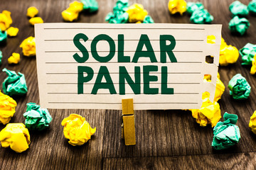 Text sign showing Solar Panel. Conceptual photo designed to absorb suns rays source of energy generating Clothespin holding notebook paper crumpled papers several tries mistakes