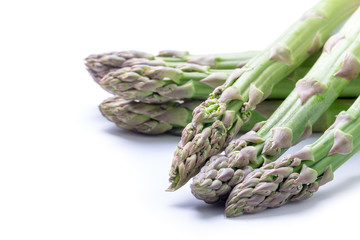 Fresh green asparagus on white