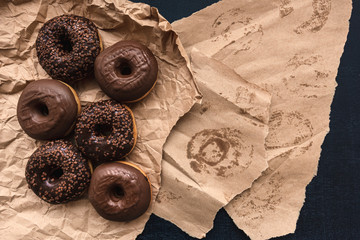 Top view of tasty homemade chocolate doughnuts