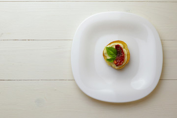 Tasty  with sun-dried tomatoes on wooden table