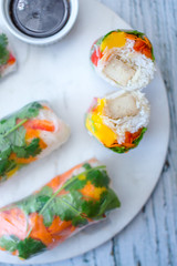 Spring Rolls on a White Plate with Sauce 