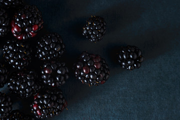 Fresh blackberries, close-ups on a dark background. Top view, flat lay