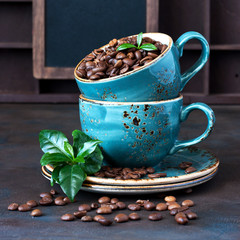 Natural background with coffee beans in ceramic mug