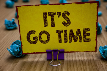 Conceptual hand writing showing It s is Go Time. Business photo showcasing A period to undertake the assigned tasks Bring it ON Clip holding yellow paper note crumpled papers several tries