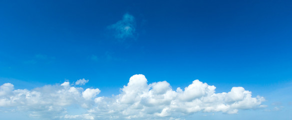 blue sky background with tiny clouds
