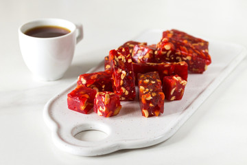 Georgian sweets churchkhela with nuts and pomegranate juice. Vegetarian.