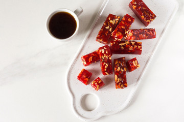 Georgian sweets churchkhela with nuts and pomegranate juice. Vegetarian.