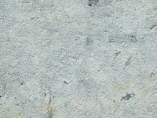sol en béton gris présentant des porosités