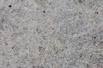 sol en béton gris présentant des porosités