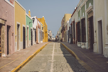colorful street during day in mexico - front view