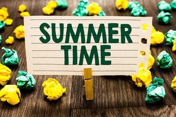 Text sign showing Summer Time. Conceptual photo Longer daylight Tropical season Beach activities Vacation Clothespin holding notebook paper crumpled papers several tries mistakes