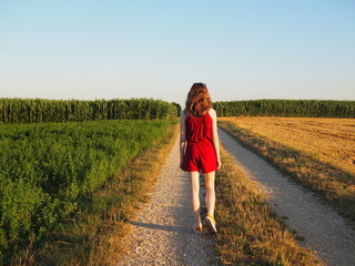 Young woman walking in the field