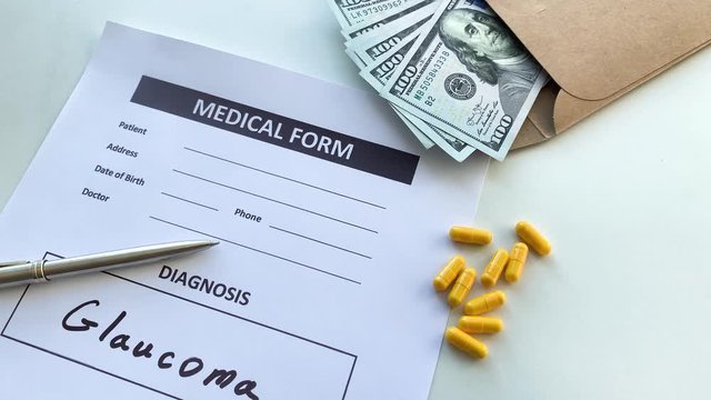 Diagnosis glaucoma in a medical form on the doctor desk