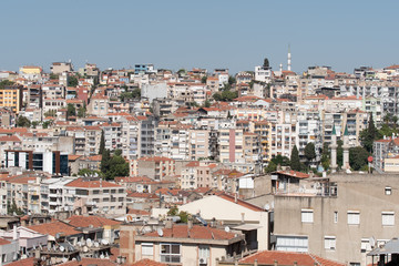 Fototapeta na wymiar View of upper parts and local houses of Konak district in seen from Asansör viewpoint in Izmir, Turkey.