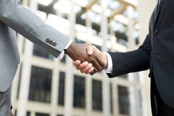 Business handshake outdoors