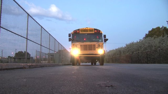 School bus arrival-stop-flashing lights-door opens-early morning