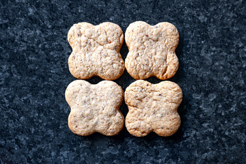 Top view nuts cookies. Nut biscuits lying on a dark marble table.