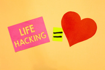 Word writing text Life Hacking. Business concept for Simple and clever techniques in accomplishing task easily Pink piece paper reminder equal sign red heart sending romantic feelings