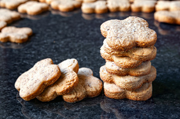 Nuts cookies. Close-up of a stack of peanut cookies lay on a dark marble table.