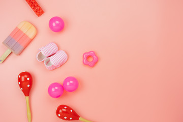 Table top view decoration kid toys for develop background concept.Flat lay accessories baby to play with items child on modern pink paper at office desk.Copy space for add text.pastel tone wallpaper.
