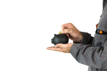 hand with black piggy bank isolated on white