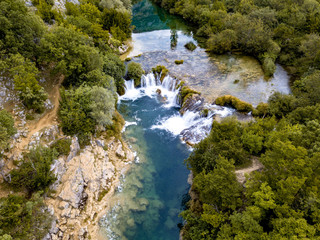 Zrmanja River in northern Dalmatia, Croatia is famous for its crystal clear waters and countless waterfalls surrounded by a deep canyon.