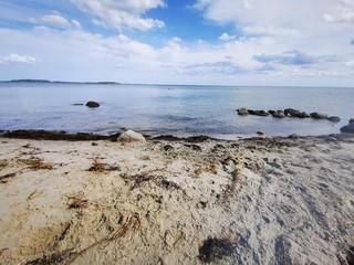 beach from the island rügen on the baltic sea with blue water and white clouds