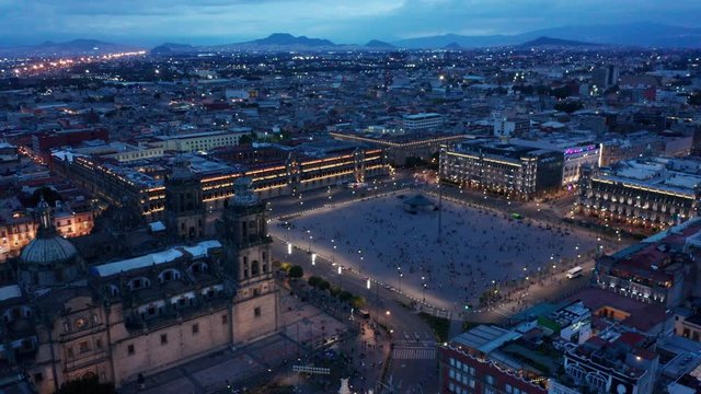 evening flying clockwise over cathedral around Mexico City Zocalo