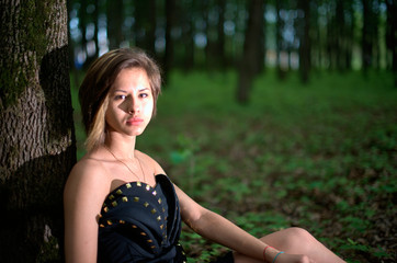 Fototapeta premium portrait of young woman in the forest