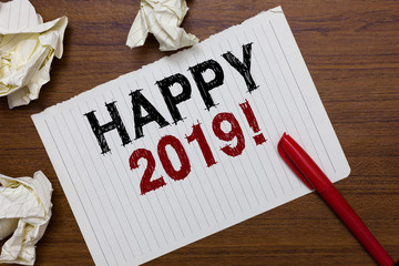 Conceptual hand writing showing Happy 2019. Business photo text time or day at which a new calendar year begin from now Marker over notebook crumpled papers ripped pages several tries