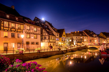 Fototapeta na wymiar colorful night view of Colmar, Alsace, France with flowers