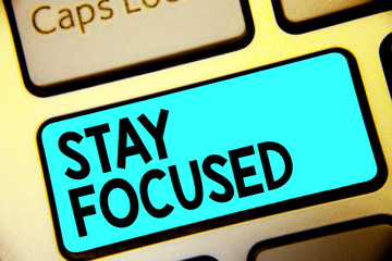 Writing note showing Stay Focused. Business photo showcasing Be attentive Concentrate Prioritize the task Avoid distractions Keyboard blue key Intention computer computing reflection document