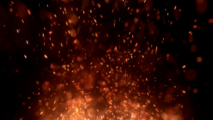 Burning red hot sparks fly from large fire in the night sky. Beautiful abstract background on the theme of fire, light and life. Burning embers glowing flying away particles over black background.