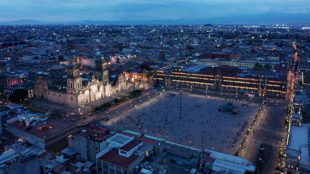 evening flying clockwise opposite National Palace around Mexico City Zocalo
