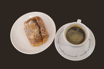 Espresso and chocolate almond croissant on white plates