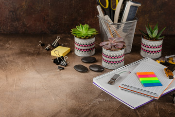 Notepad and succulents on the table. The Business Concept.