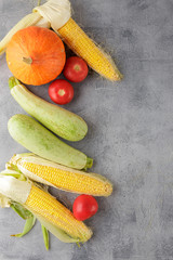 Vegetables background corn, tomatoes, zucchini