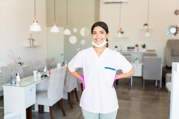 Self-Assured Salon Worker Smiling In Uniform