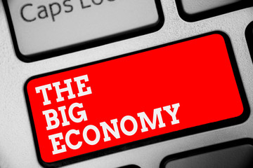 Word writing text The Big Economy. Business concept for Global finances Worldwide Market Trade Money exchange Keyboard red key Intention create computer computing reflection document